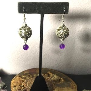 Hollow silver spheres w/ swirling floral designs